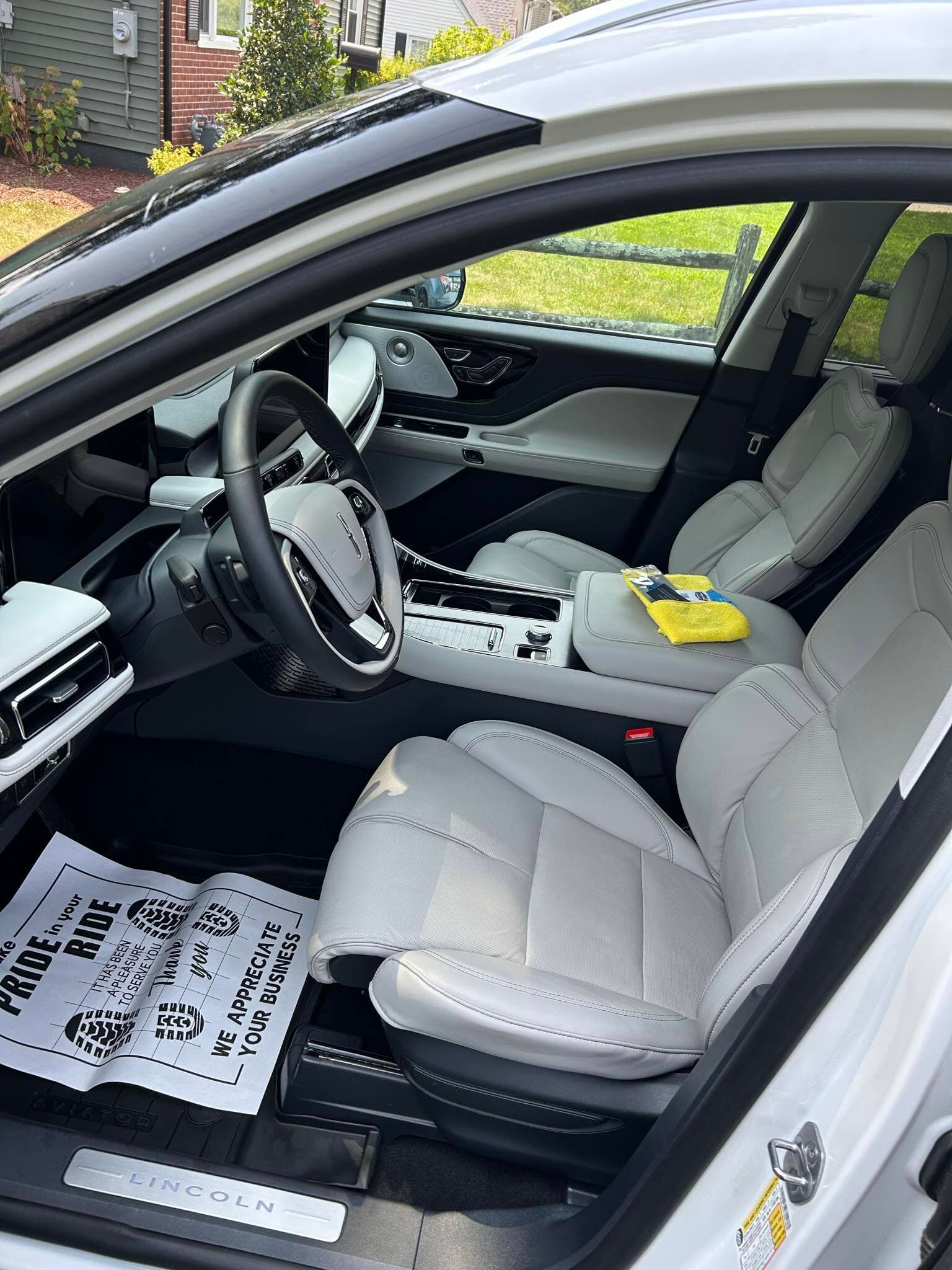 Lincoln Aviator interior after a deep clean, spotless light-gray leather